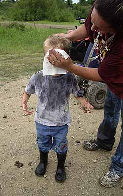 Wiping some of the gunk from Draven's face